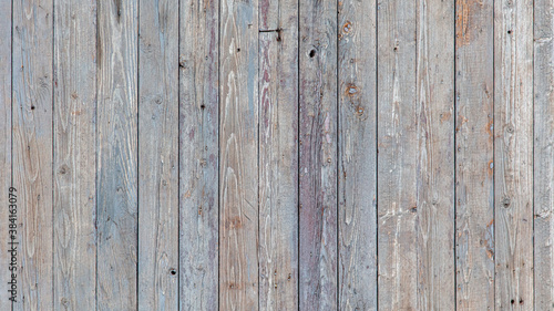 Wooden boards on an old fence as an abstract background.