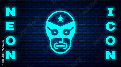 Glowing neon Mexican wrestler icon isolated on brick wall background. Vector.