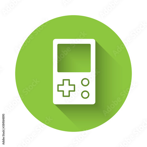 White Portable tetris electronic game icon isolated with long shadow. Vintage style pocket brick game. Interactive playing device. Green circle button. Vector.