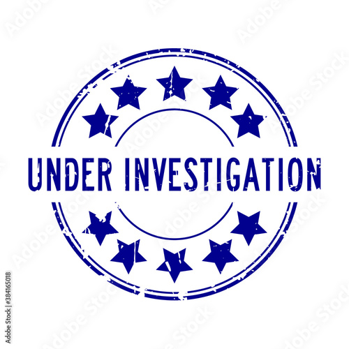 Grunge blue under investigation word with star icon rubber seal stamp on white background