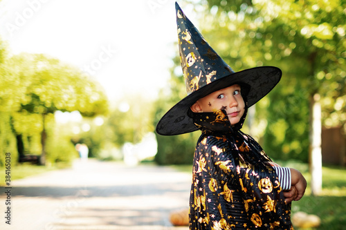 Halloween child. Kids scary Halloween concept. Expression face - surprised cute boy. Toddler in carnival costume outdoors
