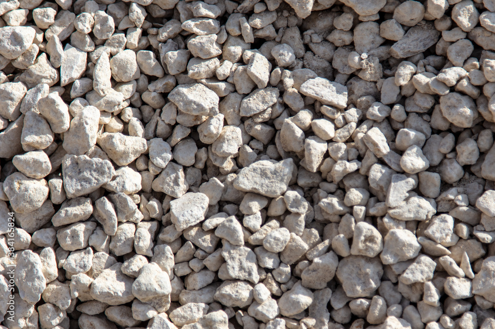 Stone gravel at a construction site as a background. Stone gravel at a construction site as a background.