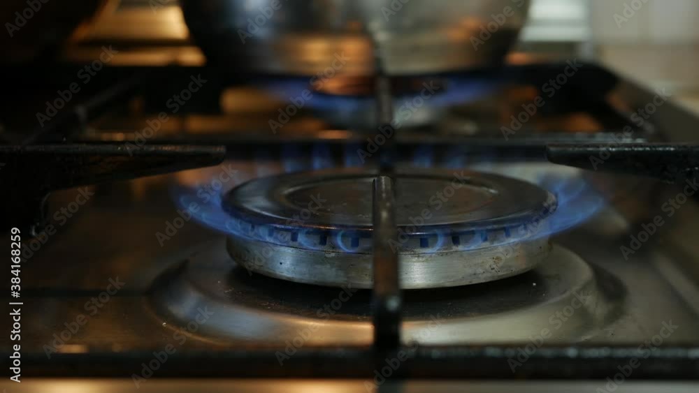 Close up with Blue Fire Flames from Kitchen Gas Cooker Burner