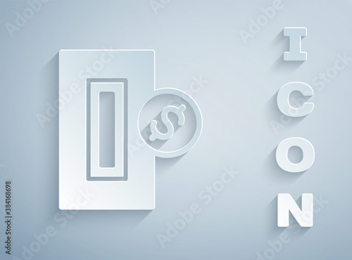 Paper cut Hand inserting coin to a slot on a vending machine or arcade machine icon isolated on grey background. Paper art style. Vector.