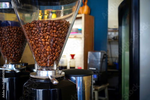 coffee beans inside electric coffee grinder machine