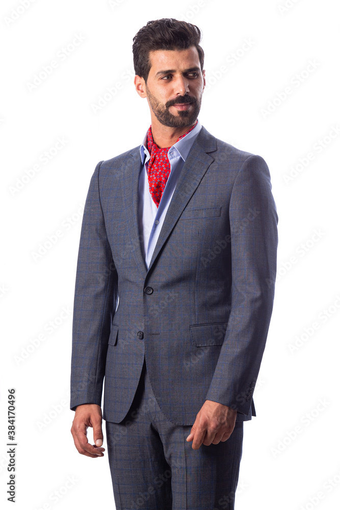 A young man wearing a black suit on a white background A young man wearing a black suit on a white background