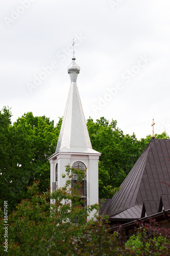 Orthodox church against the background of forest and sky in a monastery in the north of Moldova. photo