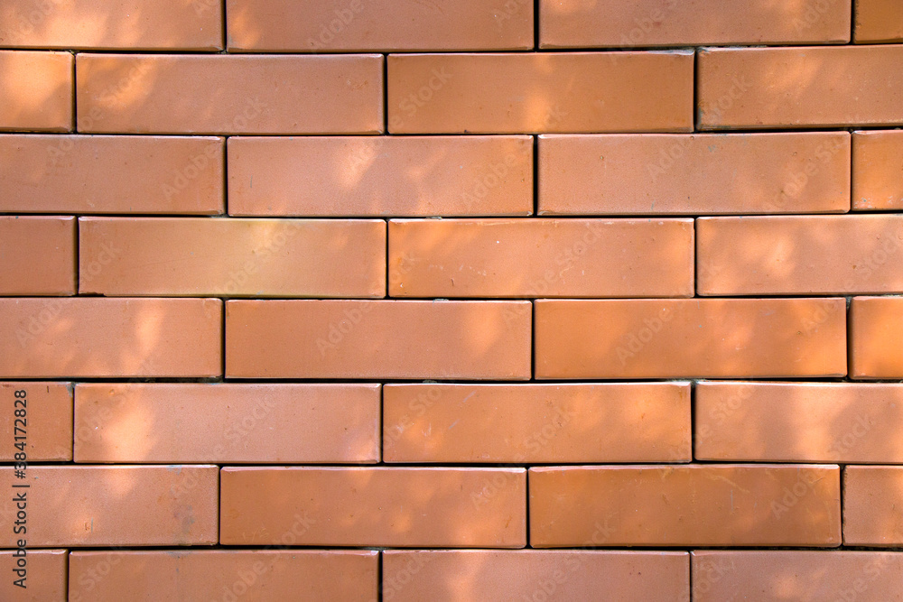 Fototapeta premium Wall background close-up, red stone background