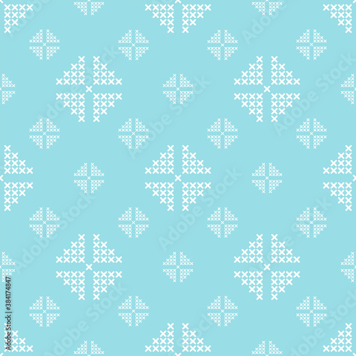 The beautiful abstract seamless pattern with the large and small white elements is on the blue background.