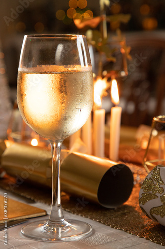 Chilled glass of white wine at a Christmas table setting