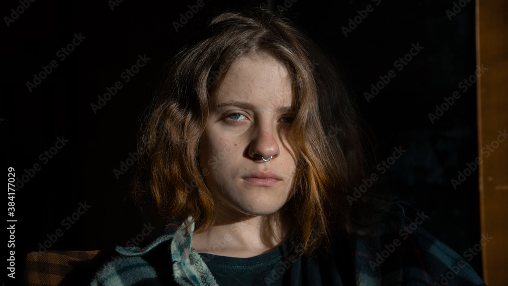 Close-up portrait of a european girl in a shirt with piercings Close-up portrait of a european girl in a shirt with piercings