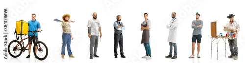 Group of people with different professions isolated on white studio background, horizontal. Modern workers of diverse occupations, male models like deliveryman, farmer, barman, butcher, sailor