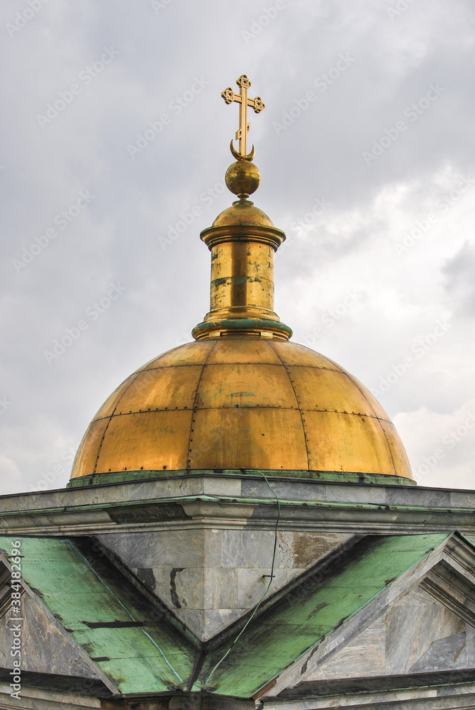 Dome with a cross of St. Isaac's Cathedral in St. Petersburg, Russia