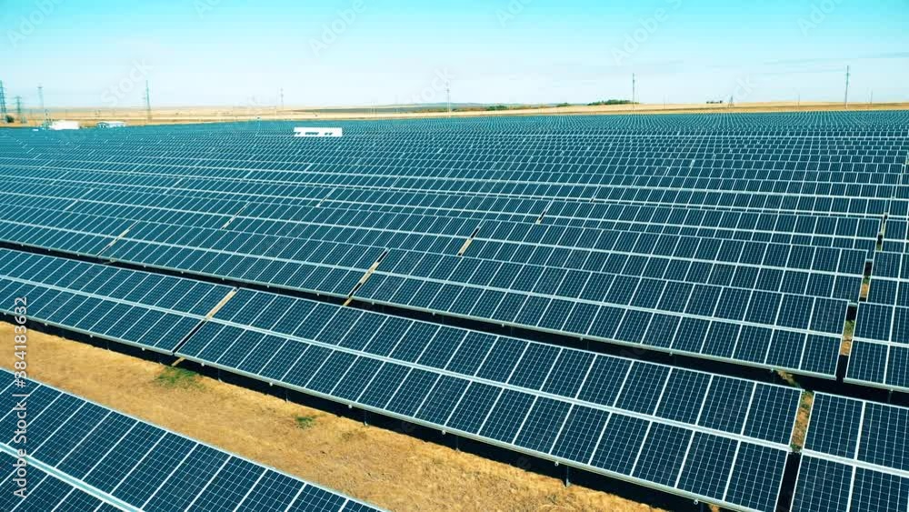 Solar power, solar panel, solar farm concept. Blue solar panels set up in a large field Solar power, solar panel, solar farm concept. Blue solar panels set up in a large field