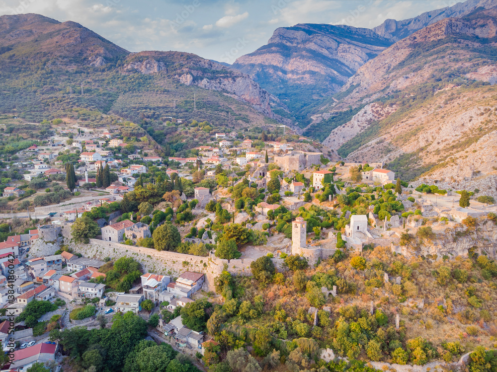 Sunset cityscape panorama of Old Bar town from ancient fortress walls. Bar, Montenegro. Drone aerial shot