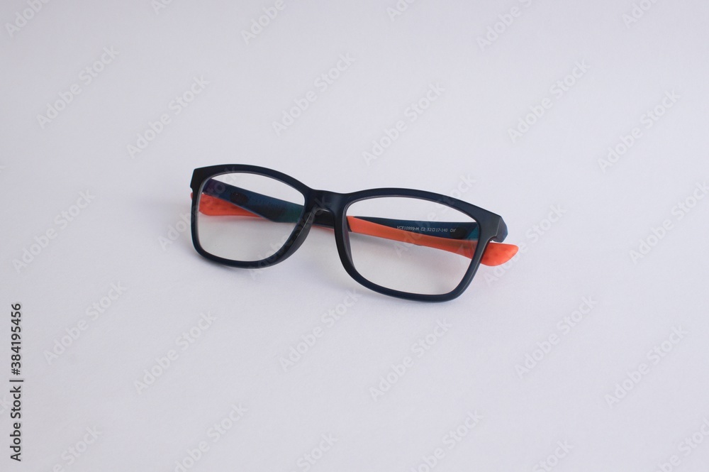 Black and orange spectacles on a white background Black and orange spectacles on a white background