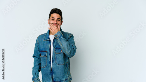 Young caucasian man isolated on white background doubting between two options.