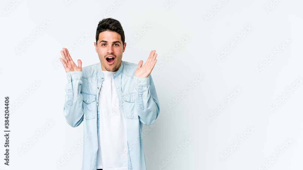 Young caucasian man isolated on white background surprised and shocked. Young caucasian man isolated on white background surprised and shocked.