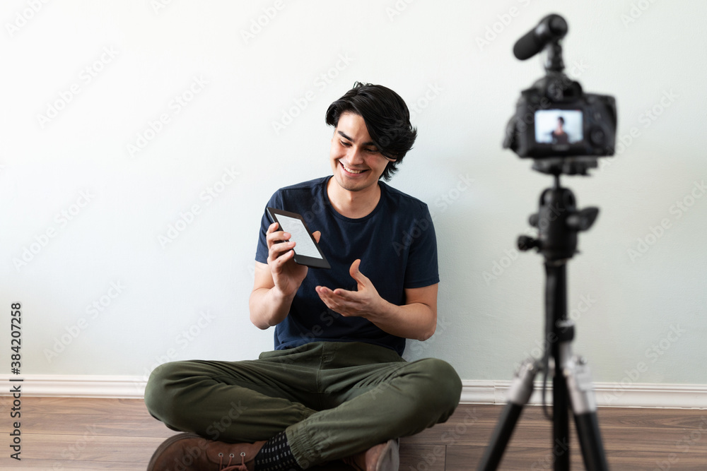 Video blogger recommending a book Video blogger recommending a book