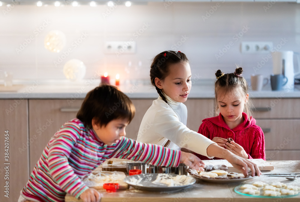 Children preparing cookies and having fun at home Children preparing cookies and having fun at home