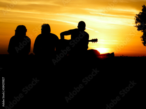 silhouettes of people at sunset, summer vibes