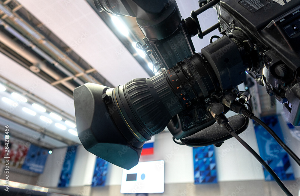 TV camera on before broadcasting a volleyball match. TV camera on before broadcasting a volleyball match.