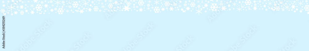 Christmas holiday abstract background. Frame of white snowflakes on blue background. Space for text, flat lay