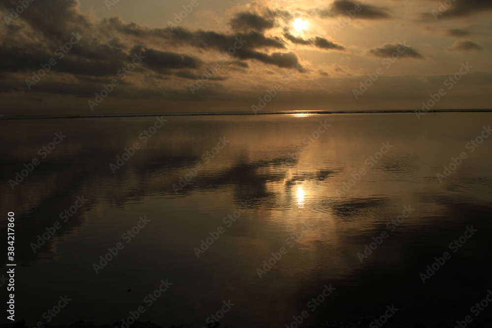 sunrise reflecting the beautiful sea water