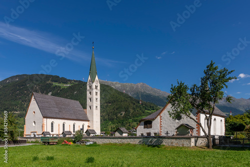 The Pfarrkirche Maria Himmelfahrt parish church in the historic center of Prutz, Austria, on a sunny day