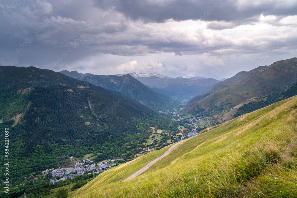 Small typical mountain villages at the bottom of a beautiful valley. Panoramic view of the Vall d'Aran, Vaqueira, Beret, Salardú, Lérida, Catalonia, Spain.