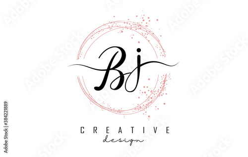 Handwritten Bj B j letter logo with sparkling circles with pink glitter.