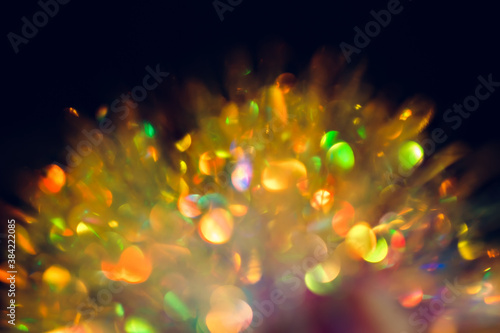 Defocus Christmas coloed bokeh is on the black background photo