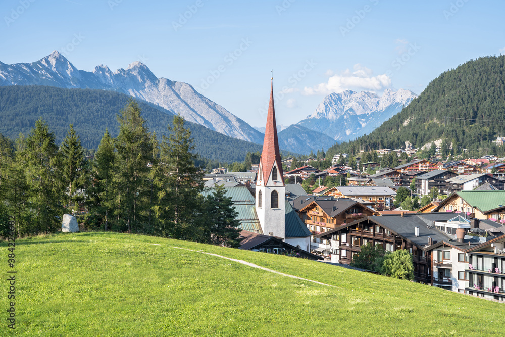 Alpine landscape with Pfarrkirche, Seefeld, Austria - obrazy, fototapety, plakaty 