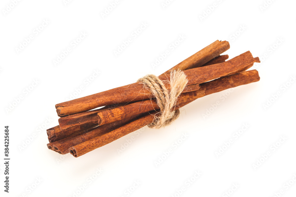 Cinnamon sticks heap isolated on white