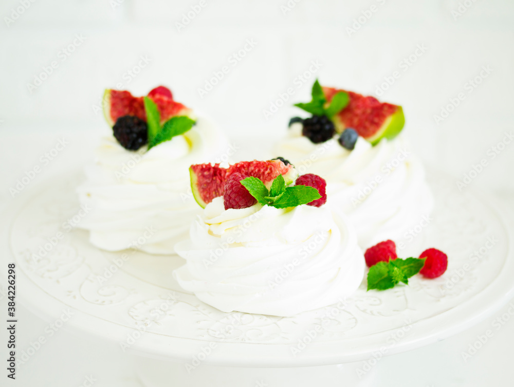 Pavlova's meringue dessert with berries and fruits Pavlova's meringue dessert with berries and fruits