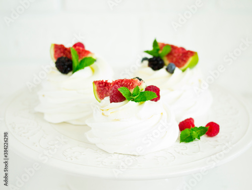 Pavlova's meringue dessert with berries and fruits