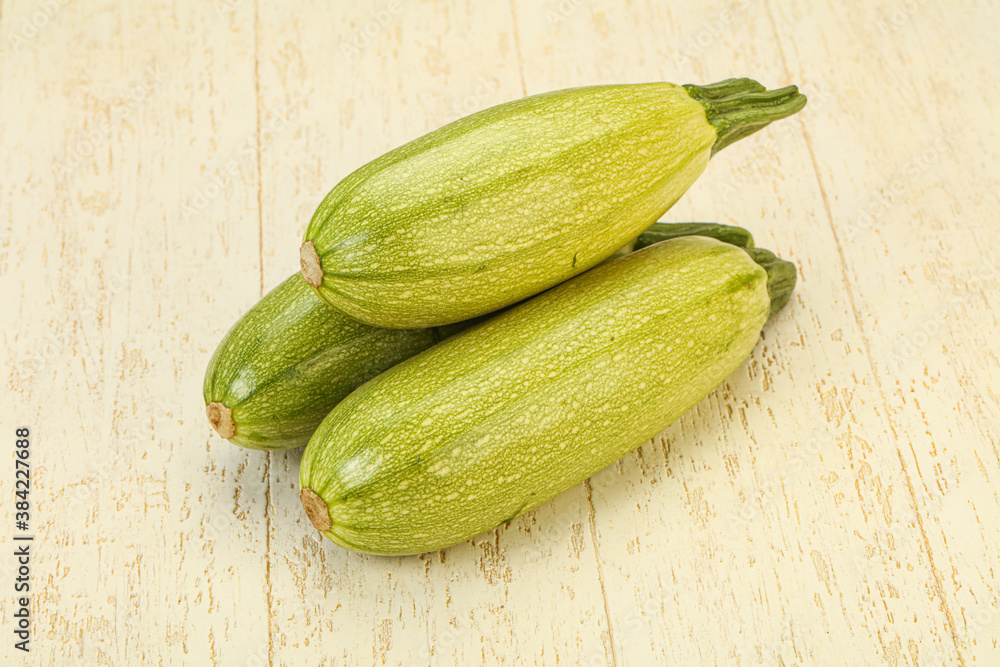 Young tasty zucchini over board Young tasty zucchini over board