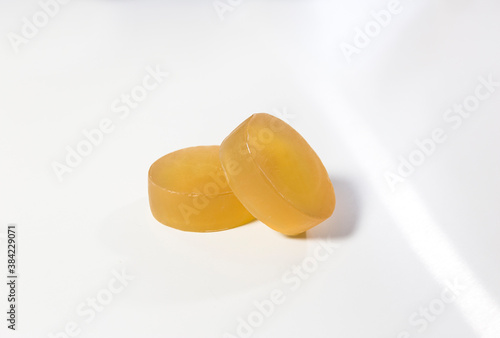 Fotografie yellow glycerin soap on white table