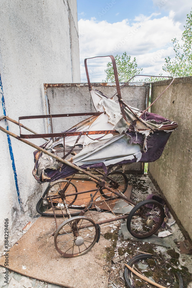  old baby carriage in an abandoned house in Pripyat
