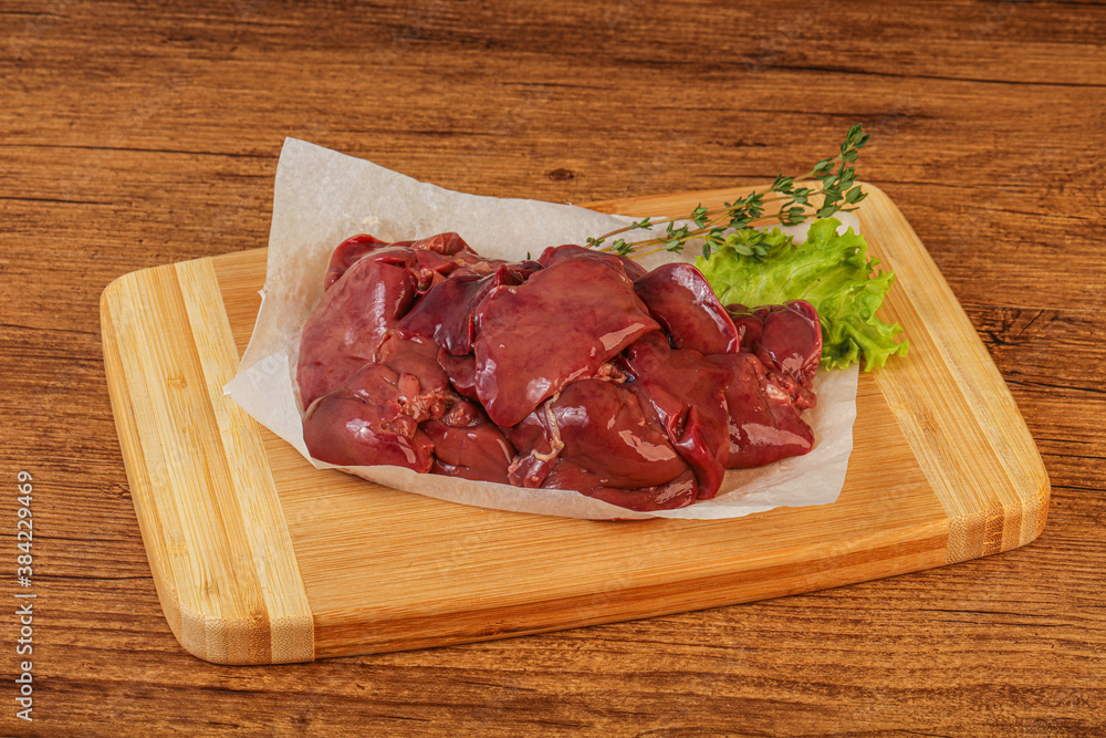 Raw chicken liver over board