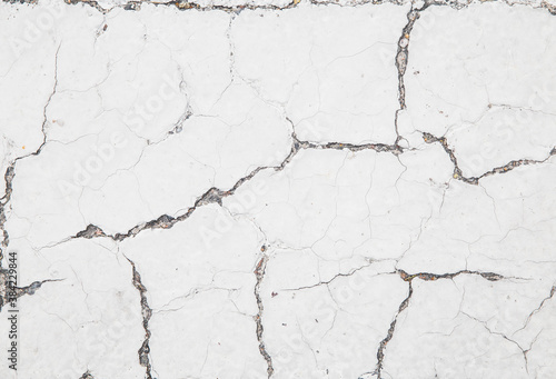 background of white cracked concrete wall close-up