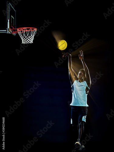 one young african basketball player man in studio isolated on black background