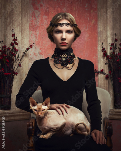 Принти на полотні Portrait of a young woman sitting with a Sphinx cat on her lap