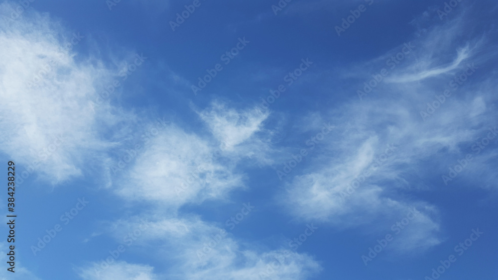 blue sky with soft clouds background.
