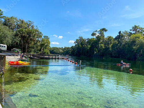 People kayaking from KP Hole County park down the Rainbow River in Dunnellon, Florida. photo