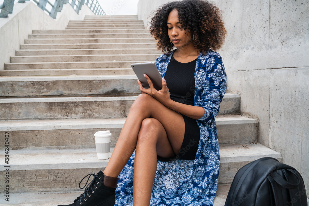 Afro american woman using digital tablet Afro american woman using digital tablet