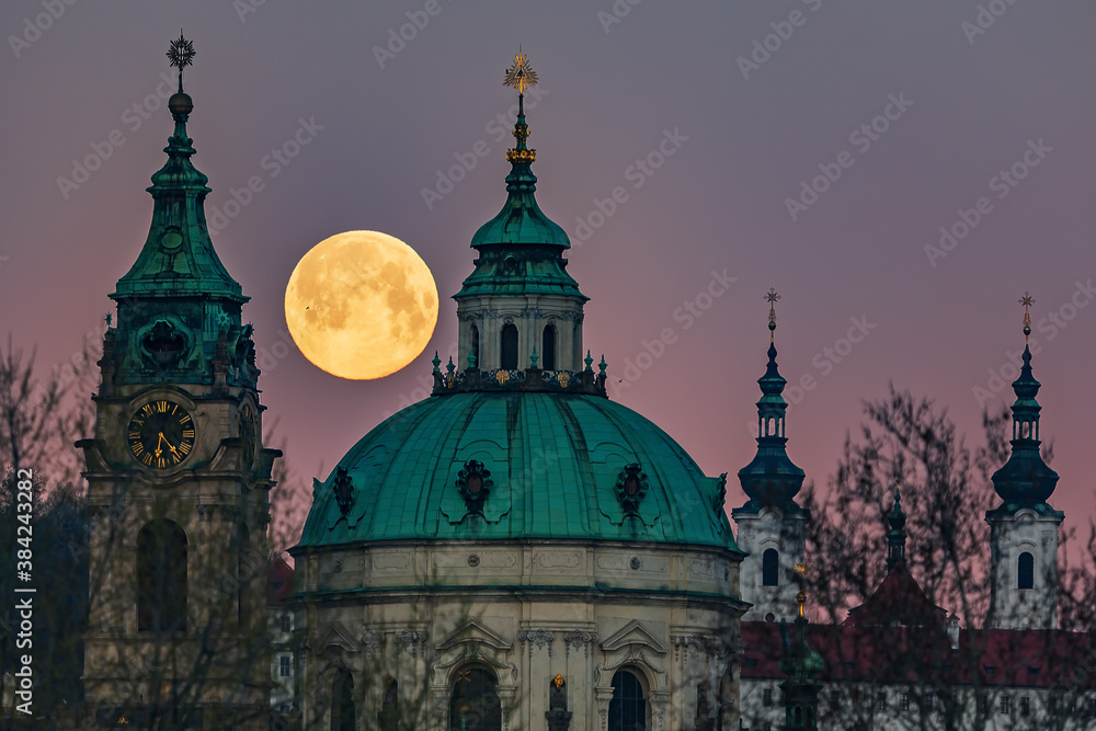 full moon over Prague and the Strahov Monastery