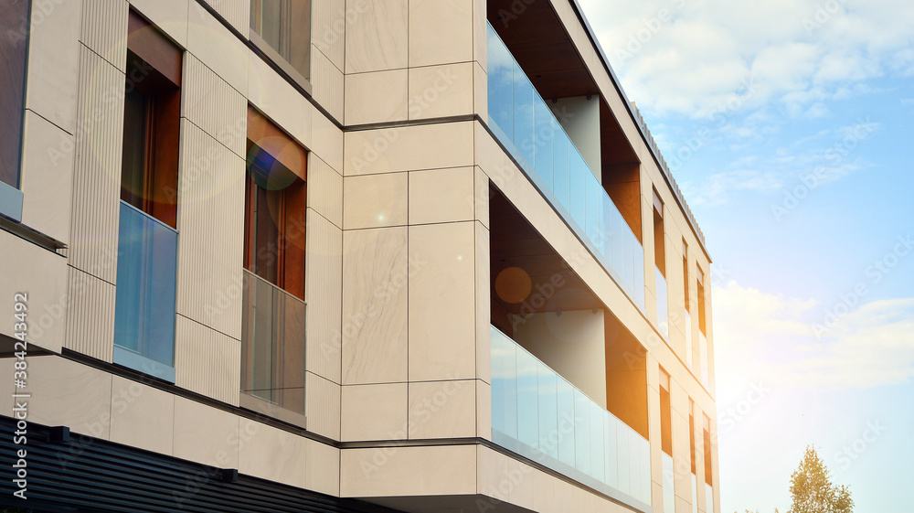 Apartment residential house and home facade architecture and outdoor facilities. Blue sky on the background. Sunlight Apartment residential house and home facade architecture and outdoor facilities. Blue sky on the background. Sunlight