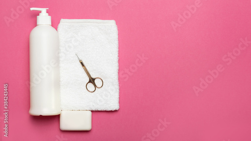 personal hygiene items for baby on pink background with copy space
