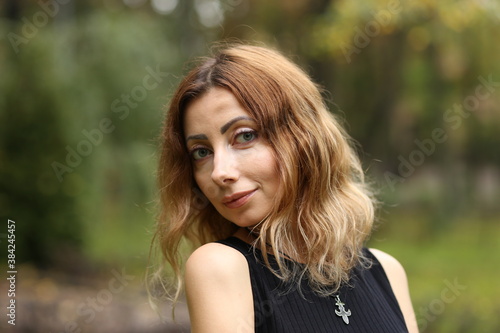 Portrait of beautiful woman in the park